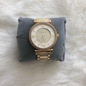 Gold Michael Kors watch with white face